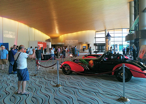Tourists stop to take pictures and to enjoy Vicci 6.2, and to watch video of the production process of artistic supercar, video of interviews.